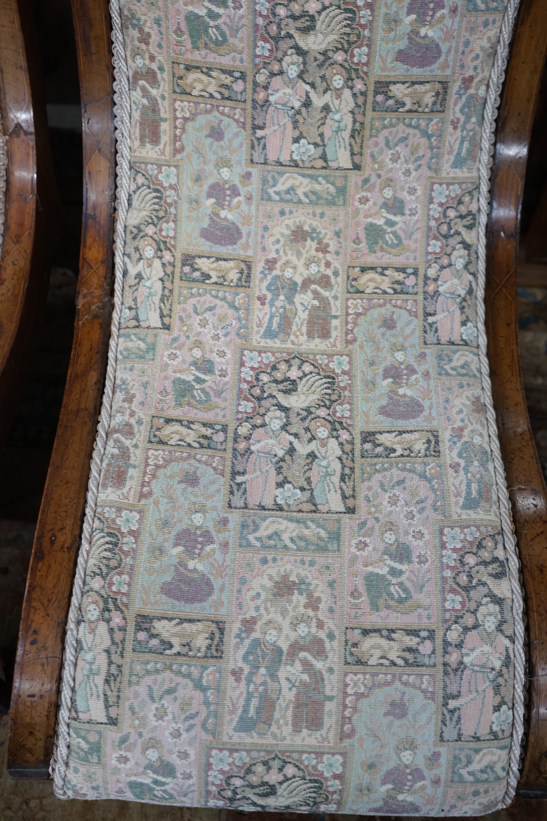 A pair of Victorian inlaid mahogany slipper chairs